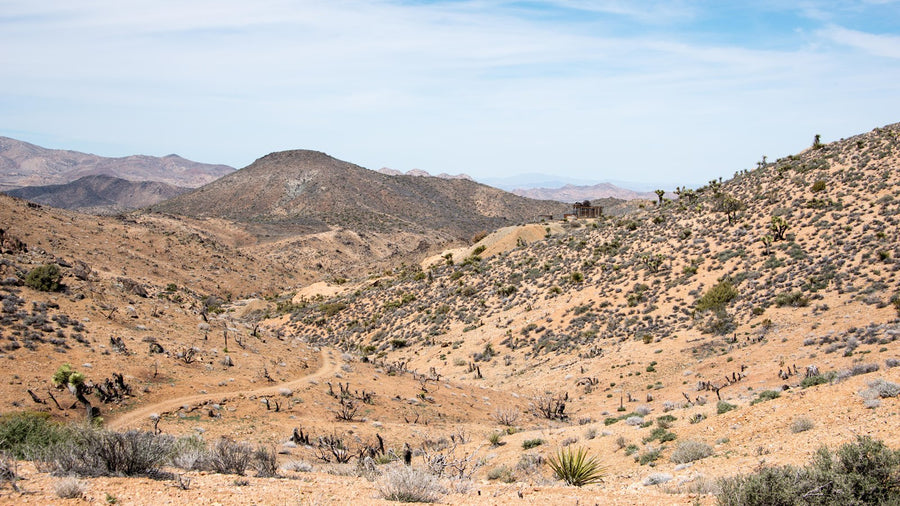 Lost Horse Mine’s wooden mill in a broad view of the mountains of Joshua Tree National Park. Photograph: NPS / Lian Law.