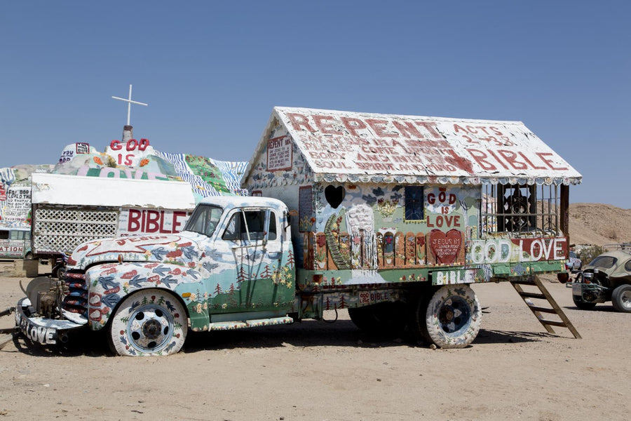 Leonard Knight’s painted truck with Salvation Mountain behind it, photographed by Carol M. Highsmith in 2012
