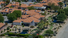 Aerial view of Villa Portofino's tile-roofed villas, landscaped paths and water features in Palm Desert. Photo by Mark Miller, September 10, 2026.