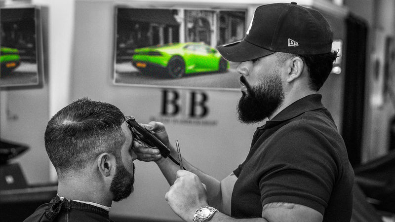 Nando providing a haircut at BLSSD Barbershop in Palm Desert, photographed by Mark Miller