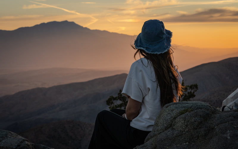 A visitor looks across the Coachella Valley from Keys View in Joshua Tree National Park at sunset. Photograph by Mark Miller.