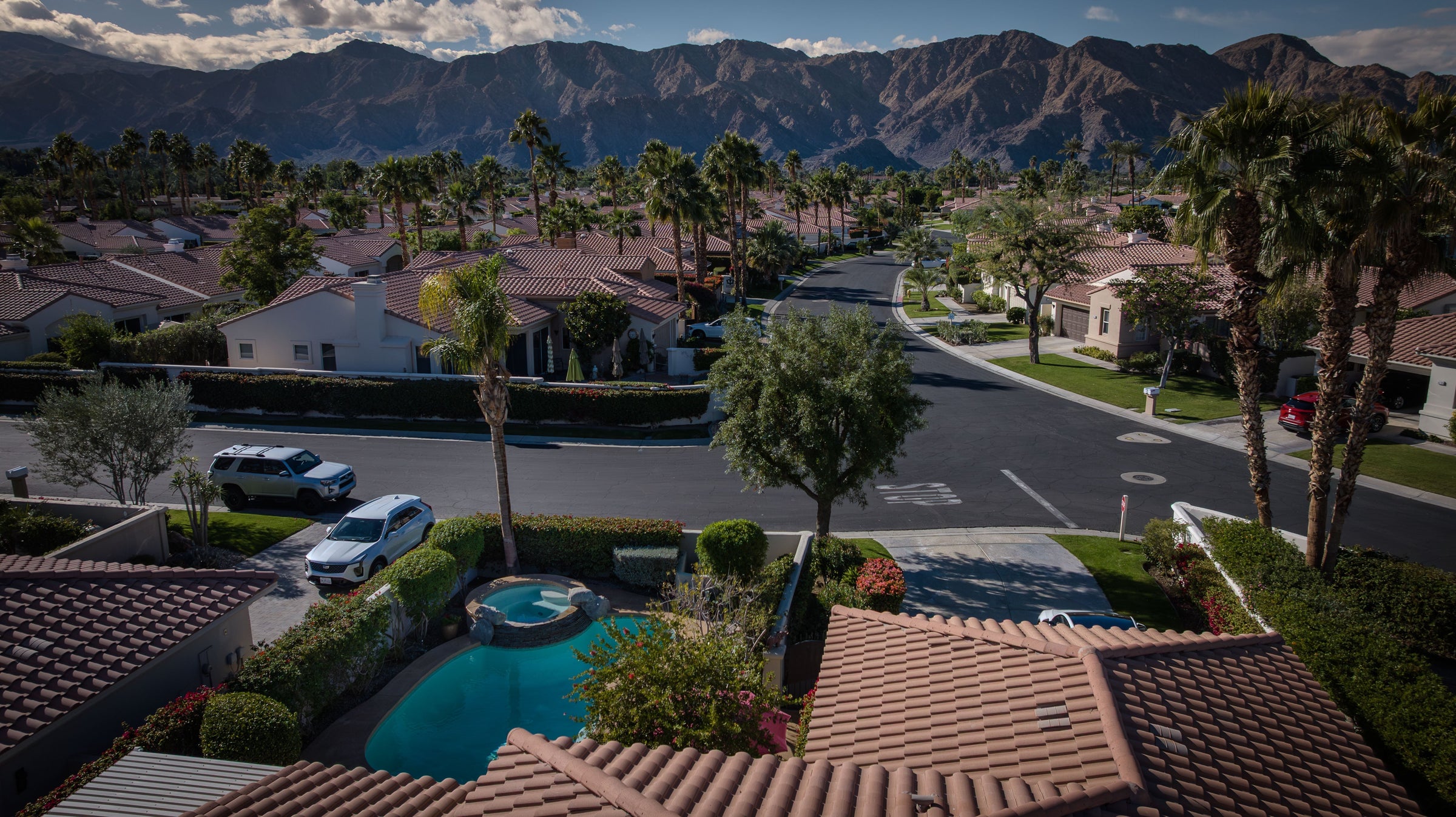 A backyard pool and mountain views at a home in La Quinta Fairways, California