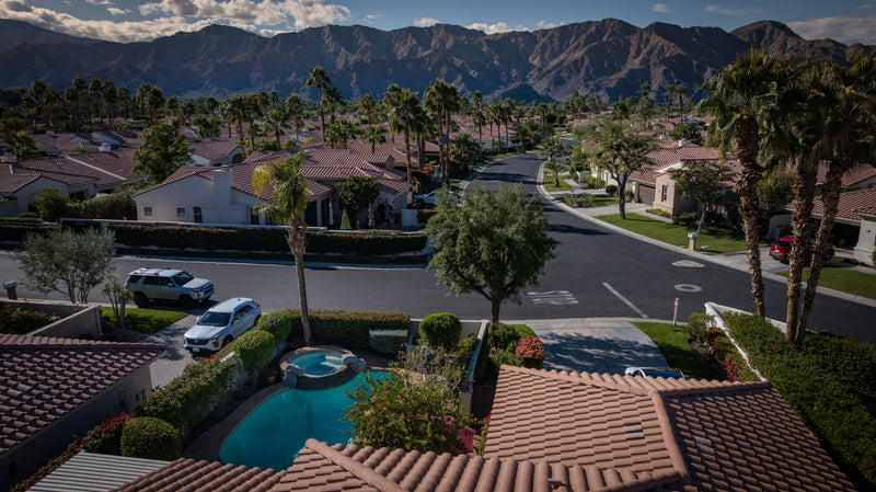 A backyard pool and mountain views at a home in La Quinta Fairways, California