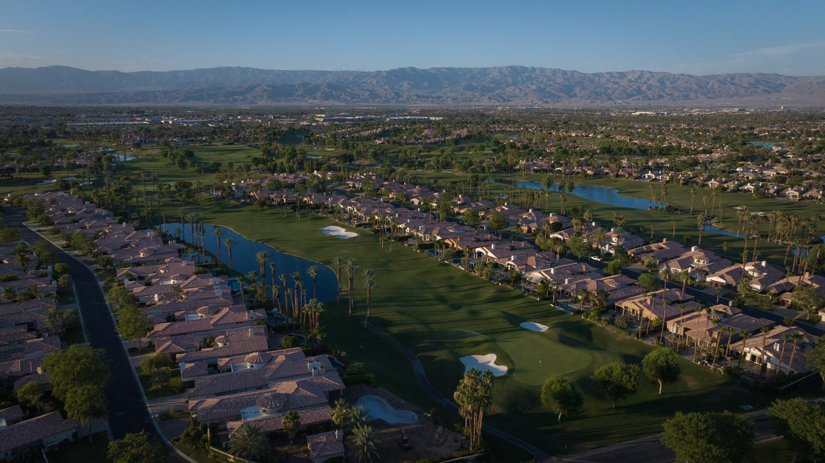 Rancho La Quinta golf-course setting, photographed by Mark Miller. Community illustration, not a specific $2 million listing.