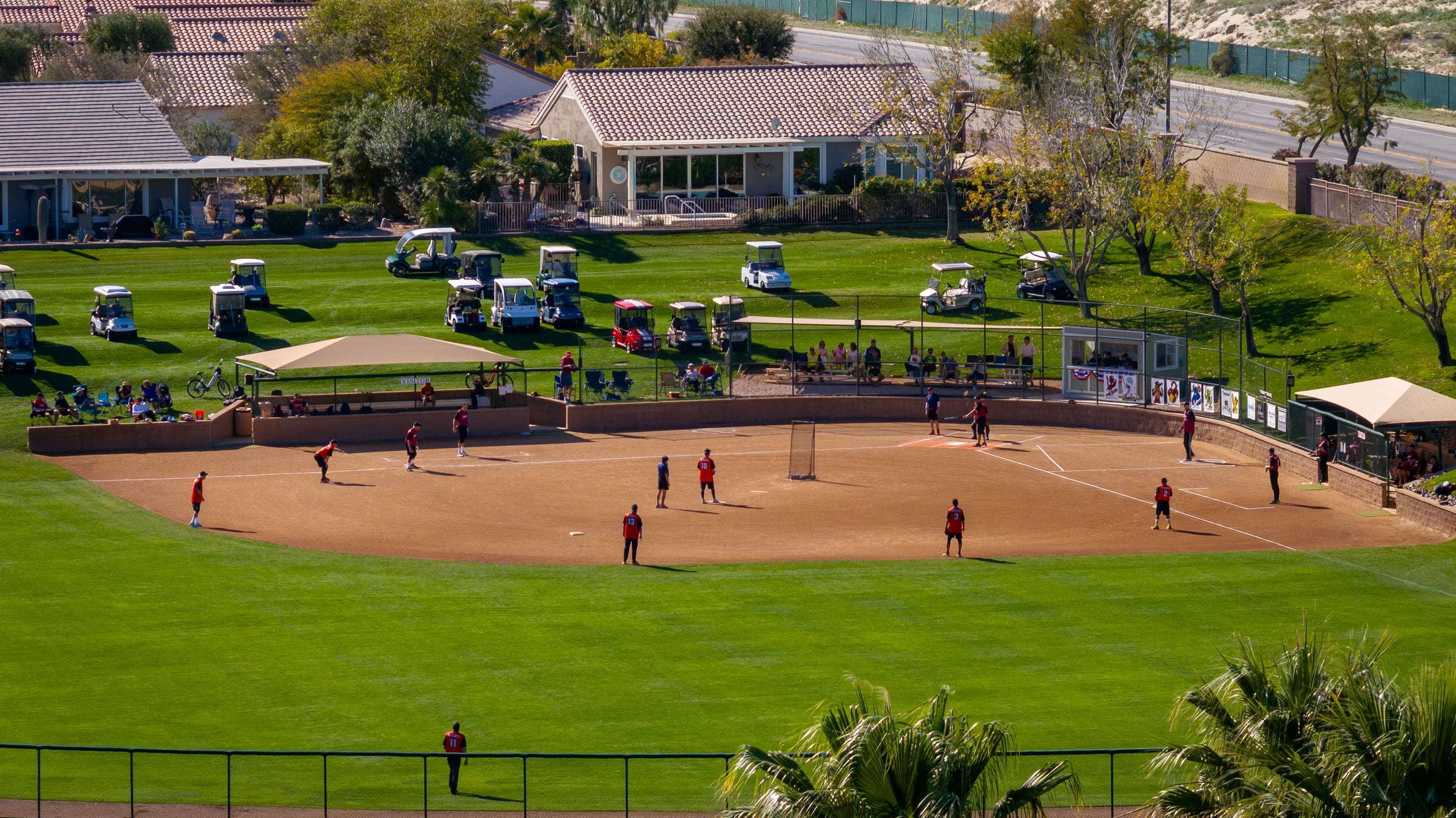 sun city palm desert softball league. Golf carts parked watching