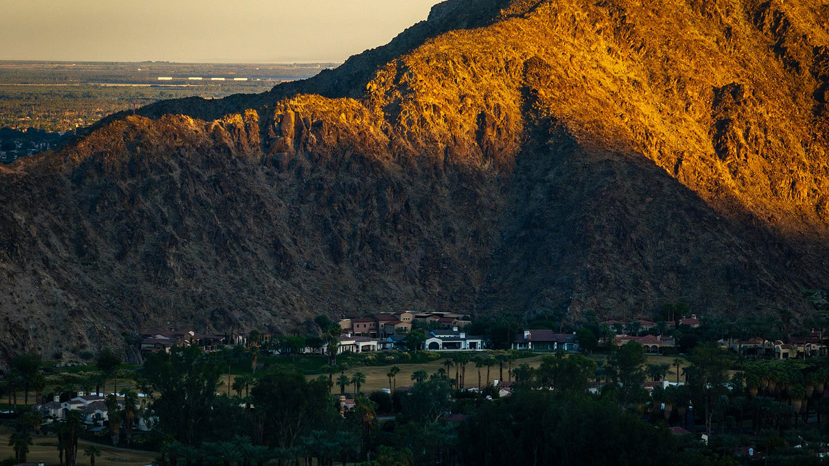 Warm golden light on the upper Santa Rosa Mountain slopes above cooler shaded terrain in La Quinta. Photograph by Mark Miller.