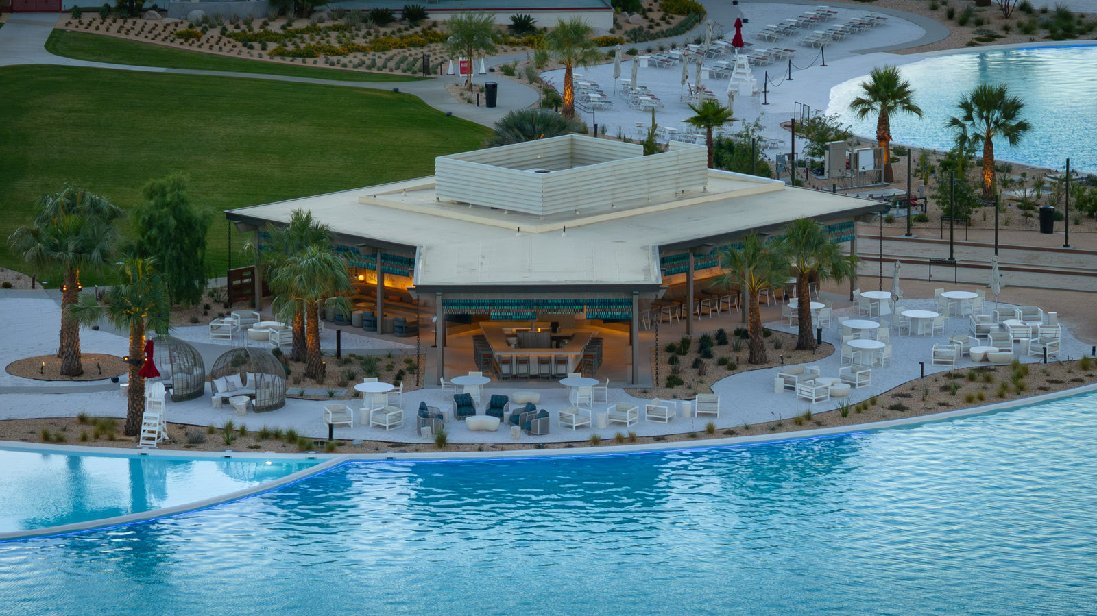 Plot Twist poolside restaurant and bar at Cotino Bay at sundown