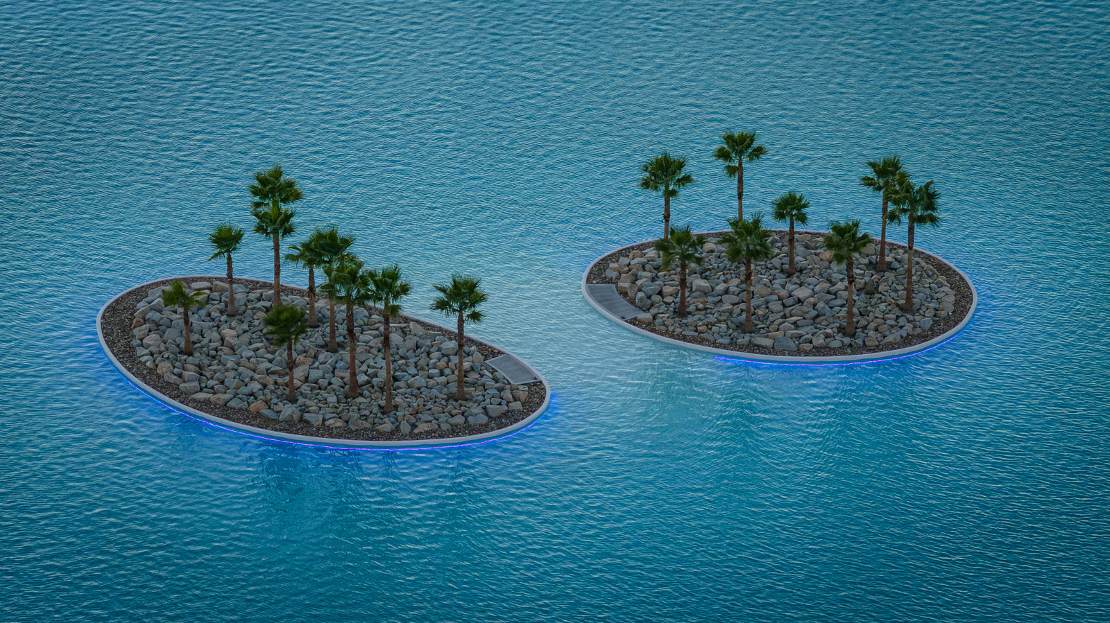 Illuminated palm islands at Cotino lagoon in Rancho Mirage at dusk