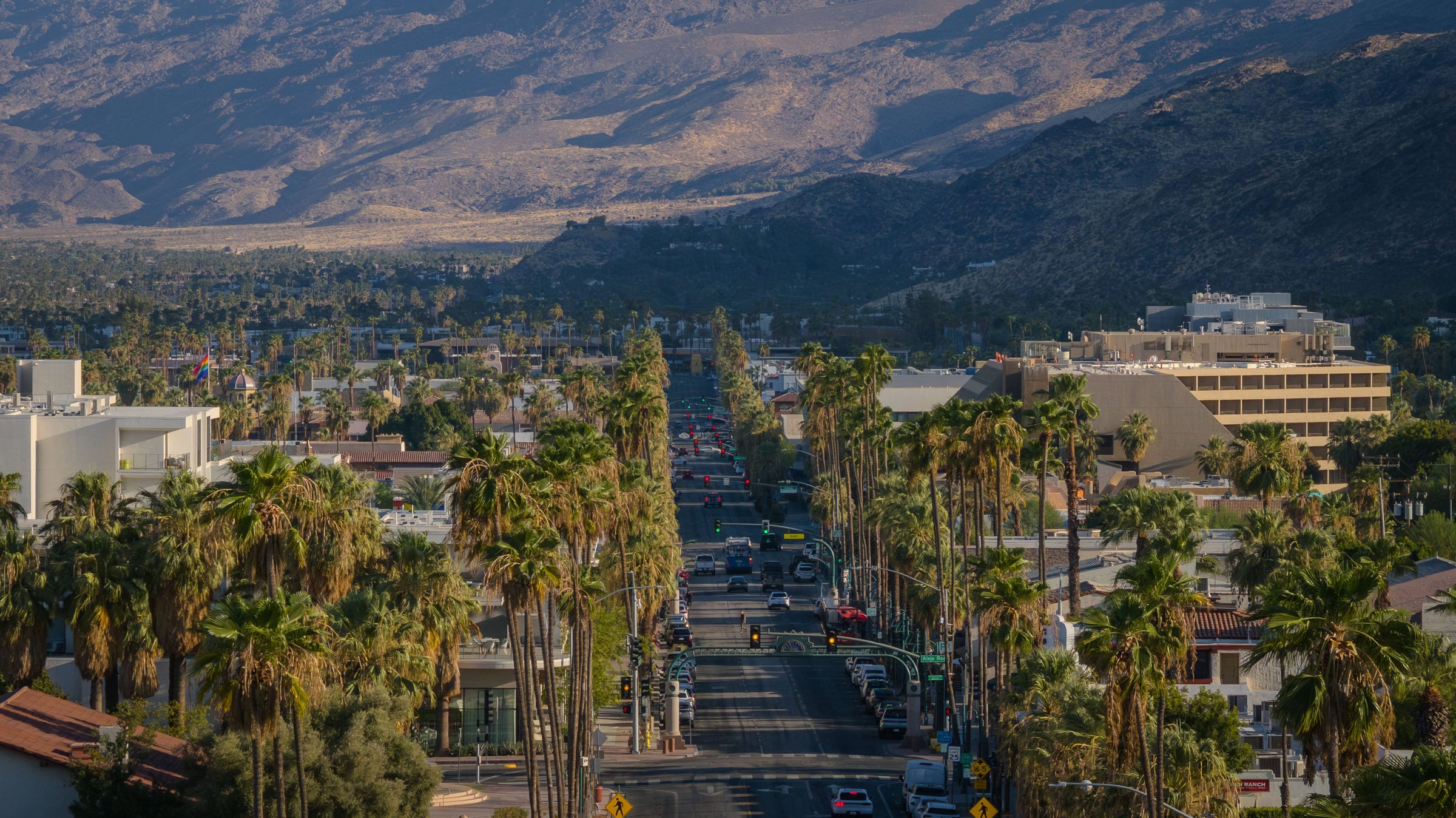 Palm Canyon Drive’s historic palm allée running through downtown Palm Springs toward the San Jacinto Mountains.