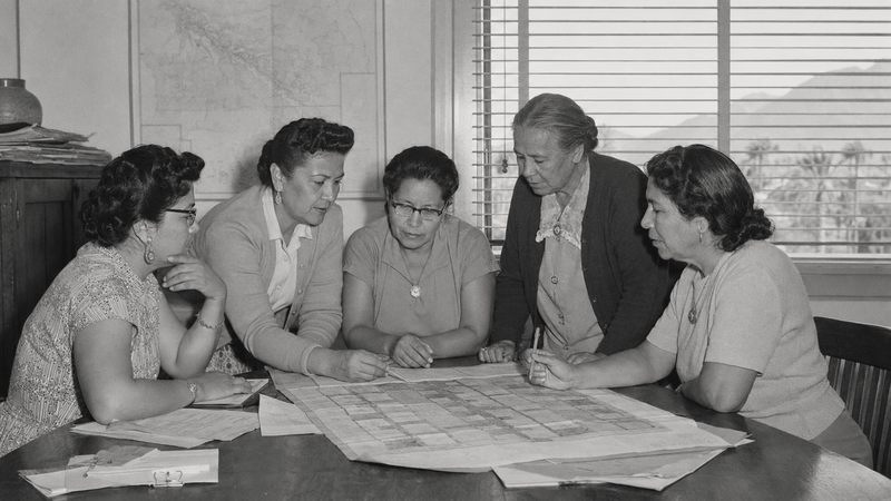 AI-generated reenactment. Five Agua Caliente women leaders review Palm Springs land plans.