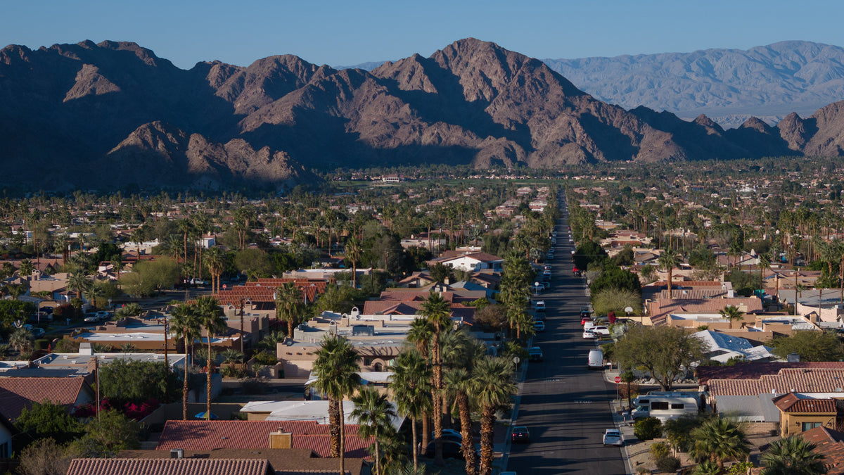 Aerial view of La Quinta Cove homes beneath the Santa Rosa Mountains in La Quinta, California