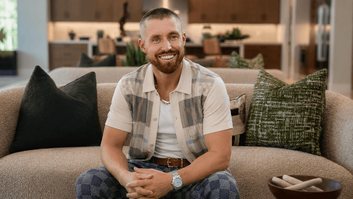 Mark Miller posing inside a Griffin Ranch home in La Quinta