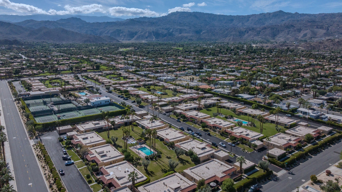 Palm Desert Tennis Club homes and tennis courts beneath the mountains