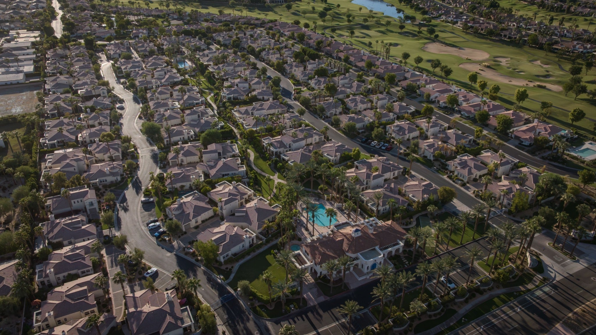 Wide aerial view of Puerta Azul beside PGA West golf course