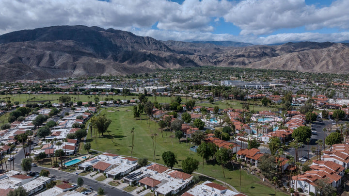 Aerial view of Rancho Las Palmas homes, golf course and mountain backdrop. Photograph by Mark Miller.