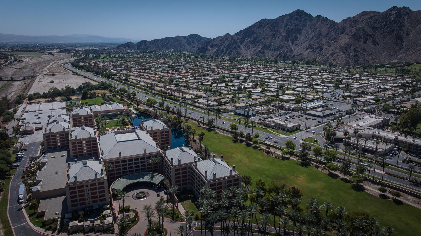 Aerial view of Renaissance Esmeralda Resort beside Highway 111 and the Santa Rosa Mountains in Indian Wells