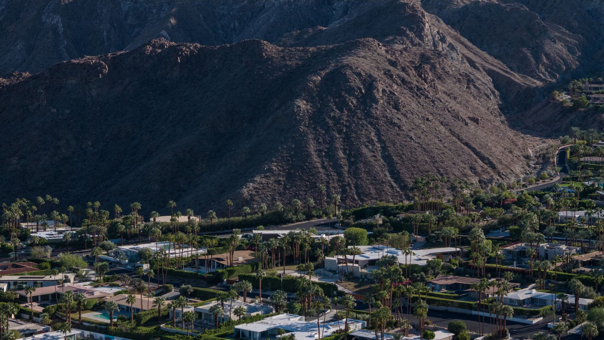 Santa Rosa Mountain foothills towering above homes and palms in the Thunderbird area of Rancho Mirage. Photograph by Mark Miller.