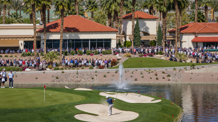 Illustrative golf scene with a golfer playing from a bunker and spectators beside the clubhouse.
