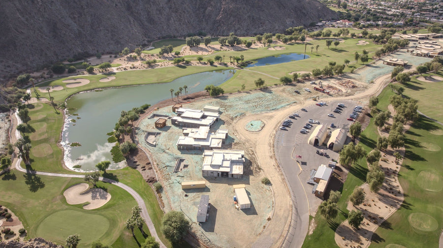 Aerial overview of the lake, unfinished buildings and Santa Rosa Mountains. SilverRock, La Quinta; photographed by Mark Miller on October 9, 2026.