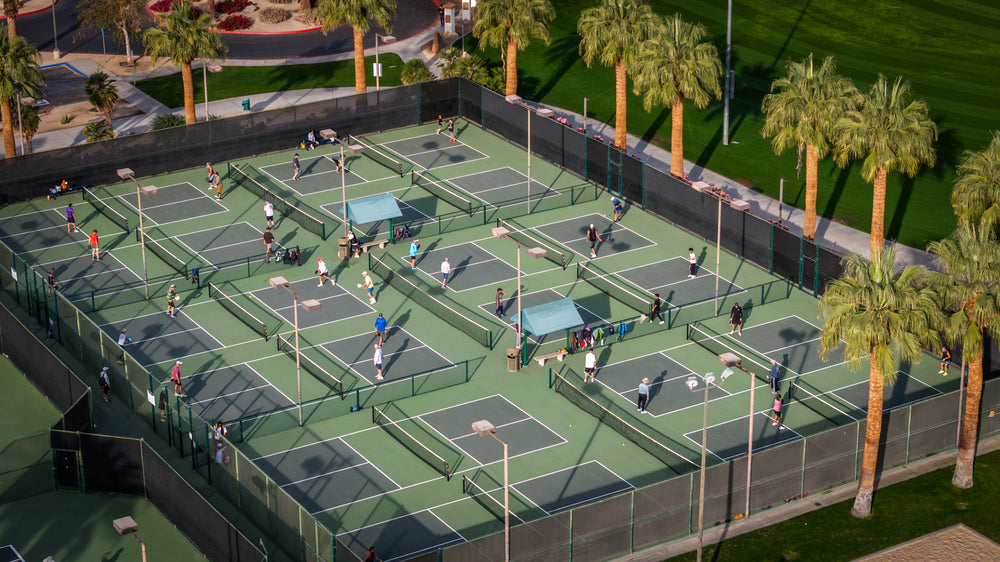 Aerial view of pickleball players on courts at Palm Desert Civic Center Park.