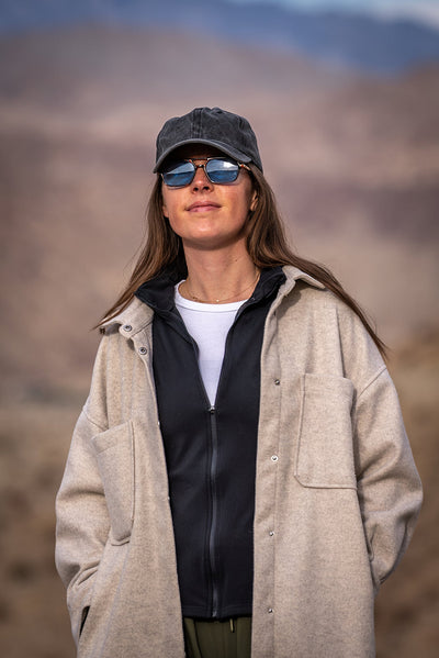 Hiker wearing a cap and sunglasses on the Randall Henderson Loop