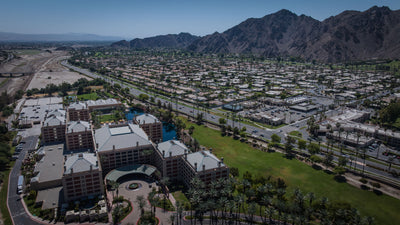 Wide aerial view of Renaissance Esmeralda with the Indian Wells valley and mountains beyond.