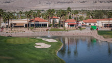 Golf course with a lake and view of shadows restaurant  in the background in scsh