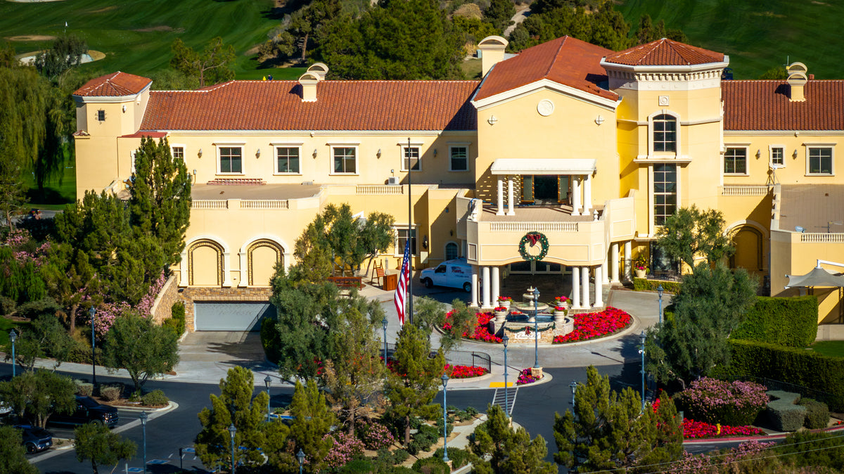 Front aerial view of The Classic Club's Tuscan-style clubhouse in Palm Desert.