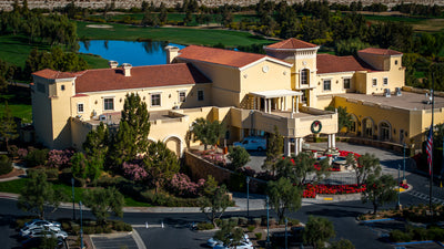 The Classic Club clubhouse with its lake, golf course and desert landscape beyond.