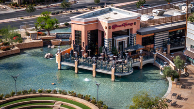 Aerial view of The Cheesecake Factory beside the amphitheater and lagoon at The River in Rancho Mirage
