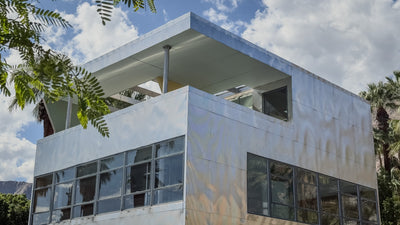 Corner view of Aluminaire House with corrugated metal panels, horizontal windows and roof terrace. Photograph by Mark Miller, October 20, 2026.