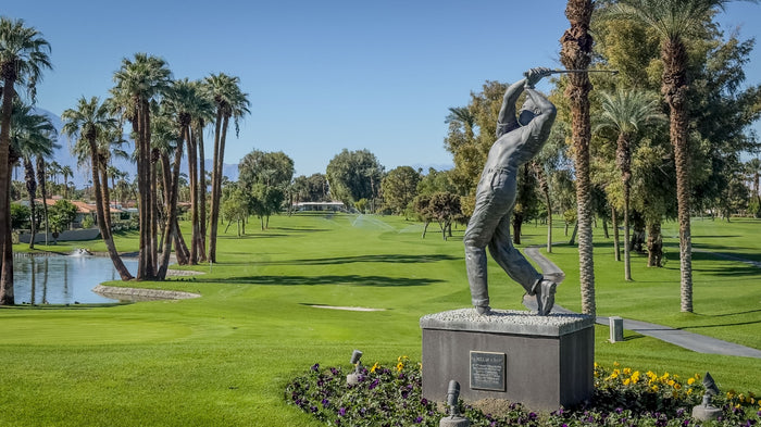 Arnold Palmer statue beside the golf course and lake at Bermuda Dunes Country Club, California. Photograph by Mark Miller.