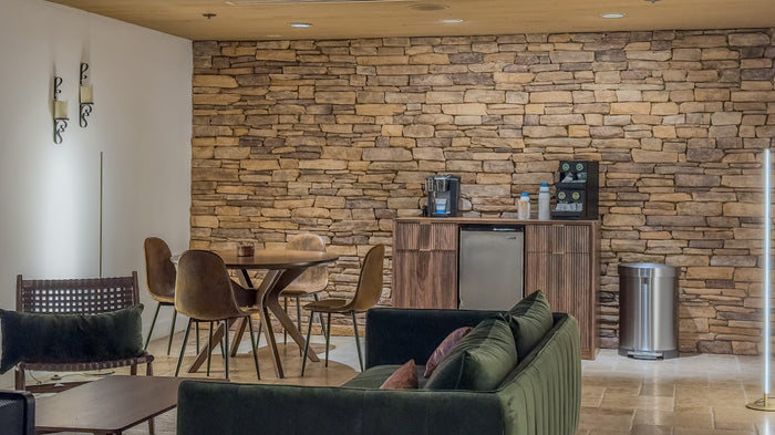 Stone fireplace and lounge seating inside the clubhouse at Bermuda Dunes Country Club, California. Photograph by Mark Miller.