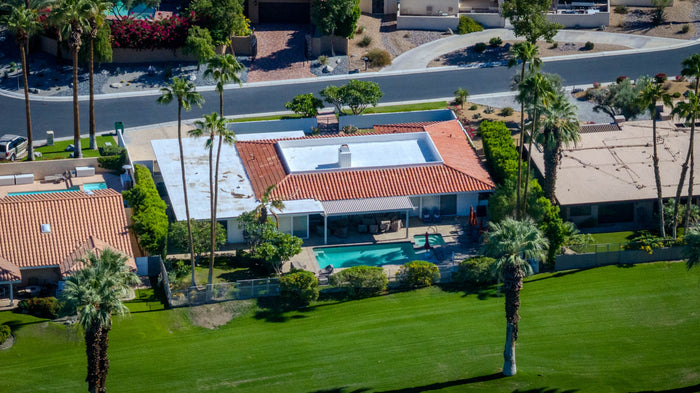 Golf course home with a swimming pool and rooftop solar panels at Bermuda Dunes Country Club, California. Photograph by Mark Miller.