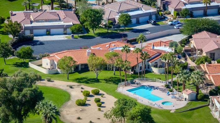 Homes with private swimming pools bordering the golf course at Bermuda Dunes Country Club, California. Photograph by Mark Miller.