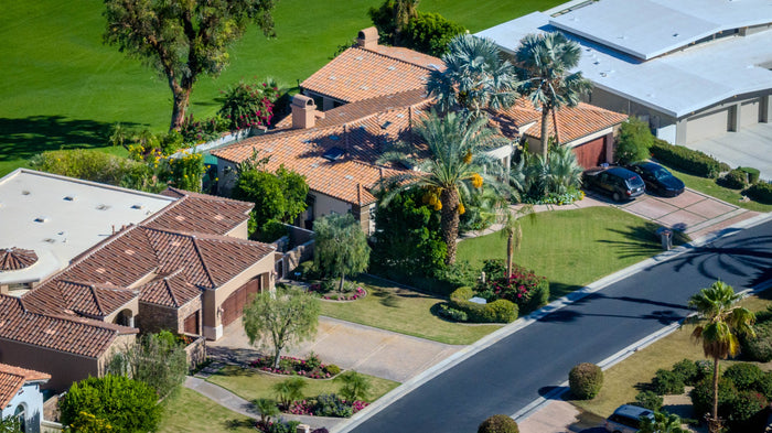 Aerial view of homes along a residential street beside the golf course at Bermuda Dunes Country Club, California. Photograph by Mark Miller.