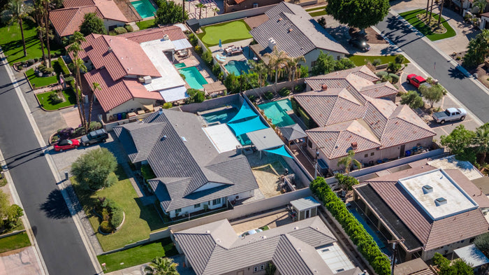Aerial view of neighborhood homes and private swimming pools at Bermuda Dunes Country Club, California. Photograph by Mark Miller.