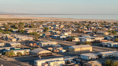 Homes and streets of Bombay Beach with the Salton Sea beyond, photographed by Mark Miller in September 2026
