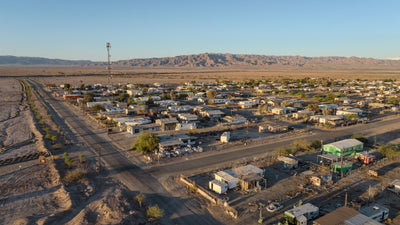 Bombay Beach street grid beside the desert and distant mountains, photographed by Mark Miller in September 2026