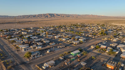 Wide aerial view across Bombay Beach toward the surrounding desert, photographed by Mark Miller in September 2026