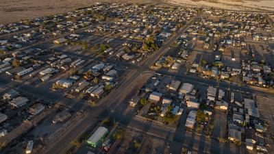 Overhead view of the residential street grid and homes in Bombay Beach, photographed by Mark Miller in September 2026