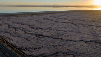 Sunset over the Salton Sea and textured exposed shoreline at Bombay Beach, photographed by Mark Miller in September 2026