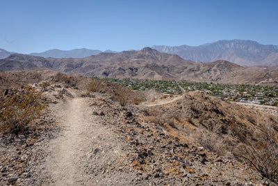 Original photograph: rocky Chuckwalla Trail with desert ridges and Rancho Mirage neighborhoods beyond.