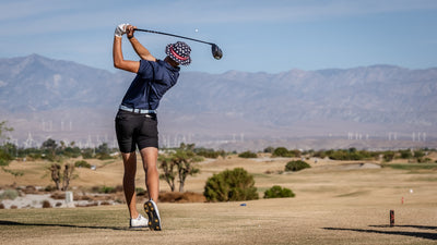 Golfer swinging above an open desert landscape at Cimarron Golf Resort. Photo by Mark Miller, September 26, 2026.