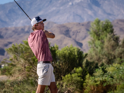 Golfer finishing a swing beside desert shrubs at Cimarron Golf Resort. Photo by Mark Miller, Cathedral City, September 26, 2026.