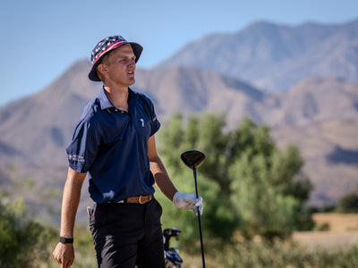 Golfer watching play with a softly focused mountain backdrop at Cimarron Golf Resort. Photo by Mark Miller, Cathedral City, September 26, 2026.
