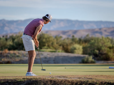 Golfer putting at Cimarron Golf Resort with desert vegetation beyond the green. Photo by Mark Miller, Cathedral City, September 26, 2026.