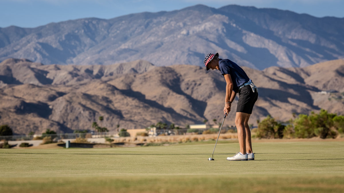 Golfer putting on a green beneath the mountains at Cimarron Golf Resort. Photo by Mark Miller, September 26, 2026.