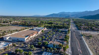 Aerial view of Citrus Plaza, Ralphs and Jefferson Street in Indio, with surrounding neighborhoods and mountains. Photograph by Mark Miller, October 27, 2026.