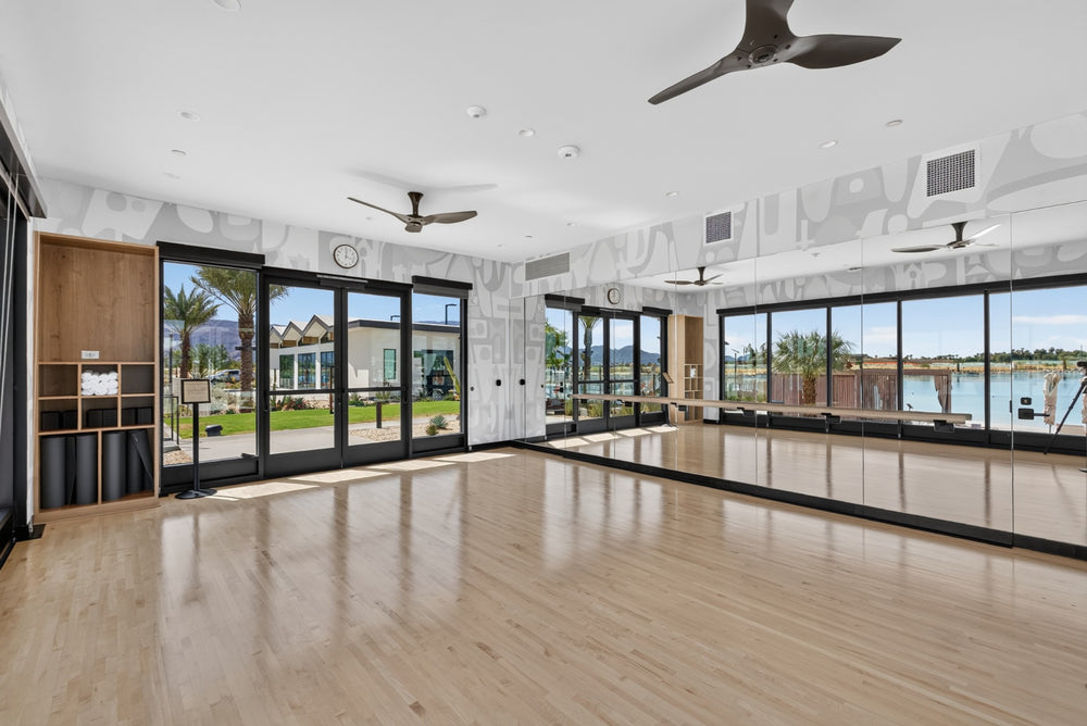 Mirrors, a wall-mounted barre and wood flooring in Cotino's Movement Studio. Photograph by Mark Miller, October 13, 2026.